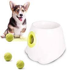 Mount a small motor, such as from a car door window, through an aluminum plate, mount the aluminum plate to a piece of wood and attach a lever to the motor. Amazon Com 2pcs Automatic Ball Launcher Dog Ball Thrower Machine Hyper Fetch Tennis Ball The Launcher Features Make Independent Play Easy And Fun And Feel Healthy And Happy Kitchen Dining