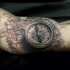 People who enjoy travelling also decide to get themselves a compass tattoo on their bodies, to tell people that the entire world is their home. Compass And Map Tattoo Map Tattoos Compass Tattoo