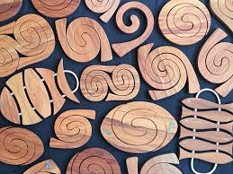 Our range of personalised name puzzles will be a winner with tots as they learn and play. Romeyn Woodcrafts Manufacturers Of Uniquely Crafted Spiral Tablemats And Coasters From Native New Zealand Timbers Promotional And Advertising Products