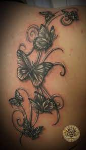 26 Tempting Swirl Tattoos Stars Swirls Butterfly Swirls Flower Swirls Swirl Tattoo Butterfly Tattoo On Shoulder Butterfly Tattoos For Women