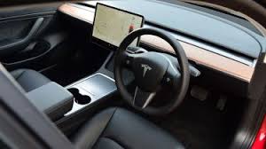 The missing of a standard grill from the front makes its design stand out from the vehicles of other companies in the market. Tesla Model 3 Interior Comfort Drivingelectric