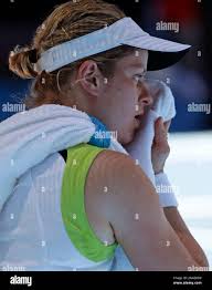 Kim Clijsters of Belgium wipes the sweat from her face during her  quarterfinal against Caroline Wozniacki of Denmark at the Australian Open  tennis championship, in Melbourne, Australia, Tuesday, Jan. 24, 2012. (AP