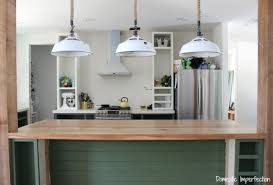 Mint green cabinetry and white quartz countertops is a charming kitchen combination, especially when paired Kitchen Progress Dark Green Cabinets A Rustic Wood Countertop And Lighting Domestic Imperfection