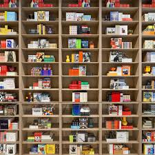 New Moma Flagship Store Boasts A Two Story Bookshelf With 2 000 Books Design Milk Store Design Design Store Book Design