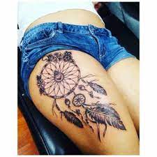 I don't approve thigh placement ideas but if you still want to go on then here is a design for you. Thigh Tribal Dream Catcher Tattoo Novocom Top