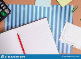 Cardboard Desk With A Striped Blue Sheet Notebook Paper And