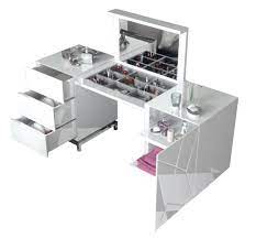 This makeup vanity set features a mirror that opens up to reveal a storage cabinet with hooks for stashing necklaces, rings, and earrings, as well as a small shelf for creams and perfumes. Orren Ellis Natividad Makeup Vanity Set With Mirror Wayfair