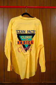 Super wonderful and summery pale yellow with a print of a windsurfer that goes all the way round the chest and back of the shirt. Vintage 80 S Op Radical Surfing Shirt Urban Outfitters