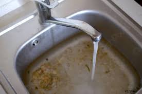 stainless steel sink plug hole close up