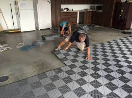 Lay Garage Floor Tiles Keeping In Mind The Loop Direction Swisstrax Flooring Garage Floor Tiles Garage Floor Floor Tile Design