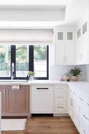White cabinets would allow the gold and black of the counter tops to really show, creating a visually appealing offset of colors. Brown And White Cabinets Huntershillart Com