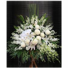 White flowers are the traditional buddhist flower of mourning and may be sent to the family. Condolence Flowers Sympathy Flower Arrangement With Stand