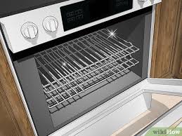 First remove everything from inside the oven, like the racks, so you can easily reach the bottom. 3 Ways To Clean The Oven Wikihow Life