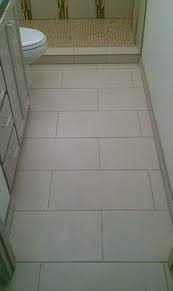 This tile is a dramatic brown. Patterned Bathroom Tiles Flooring Tile Layout