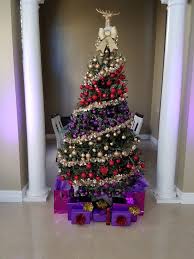 Poinsettias are a common christmas decorating motif. My Christmas Tree Purple Red And Gold Purple Christmas Tree Red Christmas Tree Gold Christmas Tree