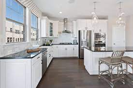 Kitchen With Pendant Lighting White Cabinets Backsplash Stainless Steel Appliances And Engineered Hardw Kitchen Layout Backsplash For White Cabinets Kitchen