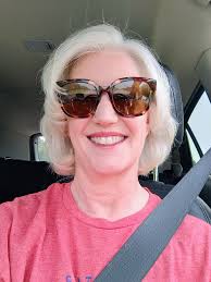 Prompt: A person holding another person upside down, using their hair as a  mop