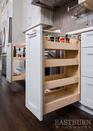 Maximize the usable under sink spaces in your cabinet, no more wasted spaces. White Kitchen Cabinets With Pull Out Spice Drawers And Topknobs Hard Interior Design Kitchen Contemporary Interior Design Kitchen Small Kitchen Cabinet Design