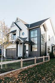 Also of note, black paint colors are quickly becoming trendy in the modern farmhouse space and can add a rather dramatic look to any room. Black And White Modern Farmhouse Exterior Home Bunch Interior Design Ideas