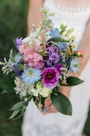 From bright blue hydrangeas to to pale blue wedding bouquets, we're sharing endless inspo for your diy wedding flower crestion! Rustic Blue And Purple Wildflower Bouquet