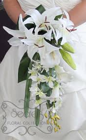 Save 20% with code 20madebyyou. Artificial White Lilies Calla Lilies Dendrobium Orchids Bridal Bouquet With Pearl Accent Front View Secrets Floral Collection