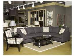 The Sleek Style Of The Track Arms Along With The Boxed Seat And Back Cushions All Supported By Dark Finish Legs Mak Living Room Furniture Living Room Sectional