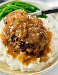 In a large bowl, mash the bread and milk together with a fork until it forms a chunky paste. Hamburger Steak With Gravy The Cozy Cook