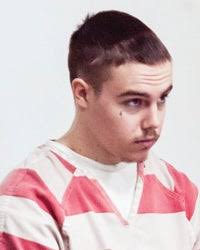 Warrant: Lacy tried to coerce co-defendant into story change