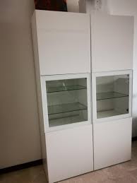 This elegant glass curio cabinet with silver base does not overcrowd the space (it's rather clasically styled and all transparent) but it displays collectibles. Display Cabinet Ikea Besta Furniture Shelves Drawers On Carousell