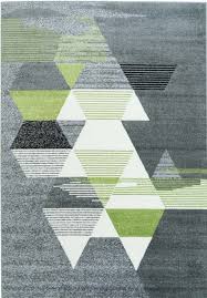 Start from the carpet up and design your perfect room around one of our favourite trends, geometric greys. Grey Green Triangles Area Rug Geometric Carpet Painted Rug Contemporary Area Rugs
