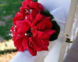 The christmas wedding flower arrangements not only deliver a festive air to the season, but also to deliver an arrangement of flowers that celebrates a wedding. Poinsettia Wedding Bouquets The Wedding Specialists Christmas Wedding Flowers Red Bouquet Wedding Wedding Bouquets