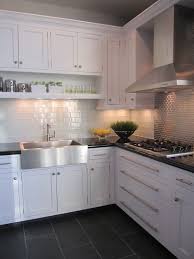 Grey cabinets, grey tiles, and grey decor can lend a sophisticated air to a kitchen. White Kitchen With Light Grey Floor Tiles Novocom Top