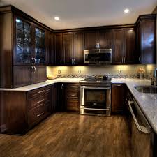 Cherry cabinetry in the kitchen brings a richness to the room and depth to the total environment. Cherry Cabinet Dark Counter Backsplash Ideas Photos Houzz