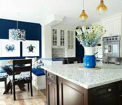 This kitchen, which was built around a red, white, and blue color scheme, is accented everywhere with nautical and shell details. Kitchen Design Nautical Kitchen Decor