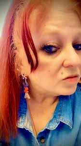 Treating oneself to jewelry, silver and red tiger eye ring and earrings