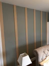 A wood panel in this dining area niche gives this room a boost (decoist.com). Easy Way To Create Wood Paneling Vertical Strips Half Way Up Wall With Wall Paper On Top Wall Paneling Diy Wood Panel Walls Wood Paneling