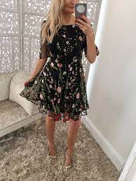 A softly sweeping layered soft net skirt enhances Black Embroidered Mesh Floral Skater Dress