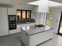 An undermount kitchen sink is installed under the counter, which creates a seamless look as there is not a rim from the sink that sits on the countertop. New Kitchen Design Having Your Sink Under The Window Kdcuk