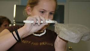 Girl Scouts make clay bowls to help others