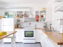 Remove everything from your cabinets, and wipe the cabinets out with a gentle vinegar or soap solution. Cleaning Kitchen Cabinets How To Clean Wood Painted Cabinets The Best Way Apartment Therapy