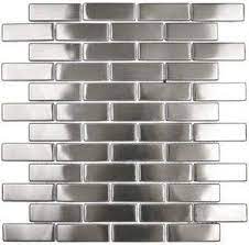 Stainless steel backsplash absorbs and reflects light. Stainless Steel Running Brick Tile Stainless Steel Tile Backsplash Stainless Steel Backsplash Trendy Kitchen Backsplash