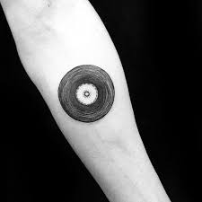 A simple and elegant tattoo if you want something. 50 Vinyl Record Tattoo Designs For Men Long Playing Ink Ideas Retro Tattoos Music Tattoos Tattoo Designs Men