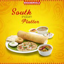 Enjoy The Southern Flavours Of India In The Delectable Platter Served At Bikanervala Made With Classic Culinary T Food Menu Design Food Captions Food Design