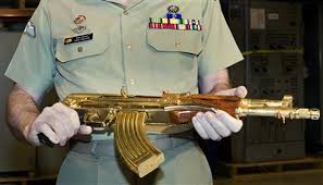 War torn steel grey brownell's ak 47. Saddam S Golden Gun Goes On Display Reuters