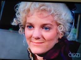 Why is the hairdo different inside Laura's house?