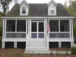 This cozy back porch in upstate new york features vibrant colors and comfortable furnishings. Here Is The Finished Product Screened The Front Porch Screened Front Porches Enclosed Front Porches Porch Railing Designs