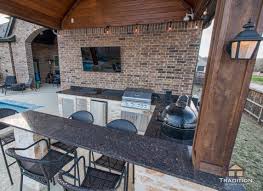 Avoid multiple trips inside your home for food and beverages while entertaining your guests by adding a compact refrigerator to your outdoor kitchen. Covered Patio With Outdoor Kitchen In Fulshear Tradition Outdoor Living