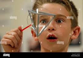 CAPTION: (New Port Richey 02/21/2008) (photo1) Cypress Elementary School  student Gavin Gruwell (cq) gets a closer look at the once triangular, now  round bubble he created by blowing the soap within a