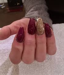 Since acrylic nails are a combination of liquid monomer and powder polymer when applied to your nails and exposed to the air, they form a hard layer, so you're guaranteed to have cute and strong nails. Dark Purple Red Nails With Gold Glitter Red Nails Glitter Dark Red Nails Red And Gold Nails