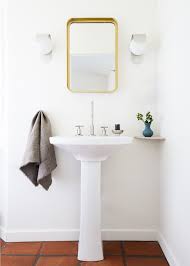 A slender, horizontal sink saves space in a small bathroom. How To Decorate Your First Apartment First Apartment Decorating Ideas
